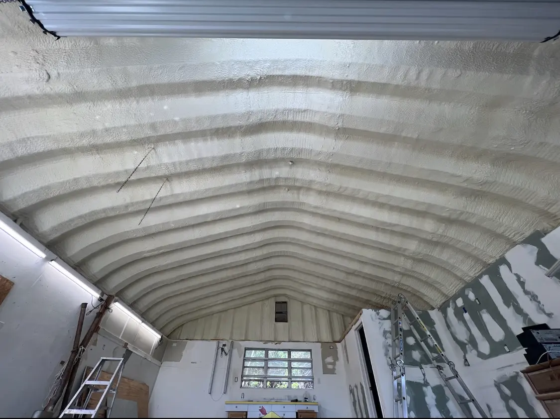 Spray polyurethane foam applied to the underside of a metal roof deck in Round Lake Beach